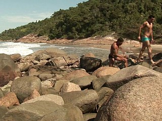 Two gay Latinos are on the beach sucking penis and banging asses