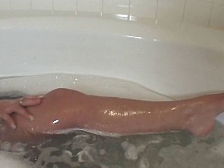 POV of a hungry nympho sucking a giant chode in the tub